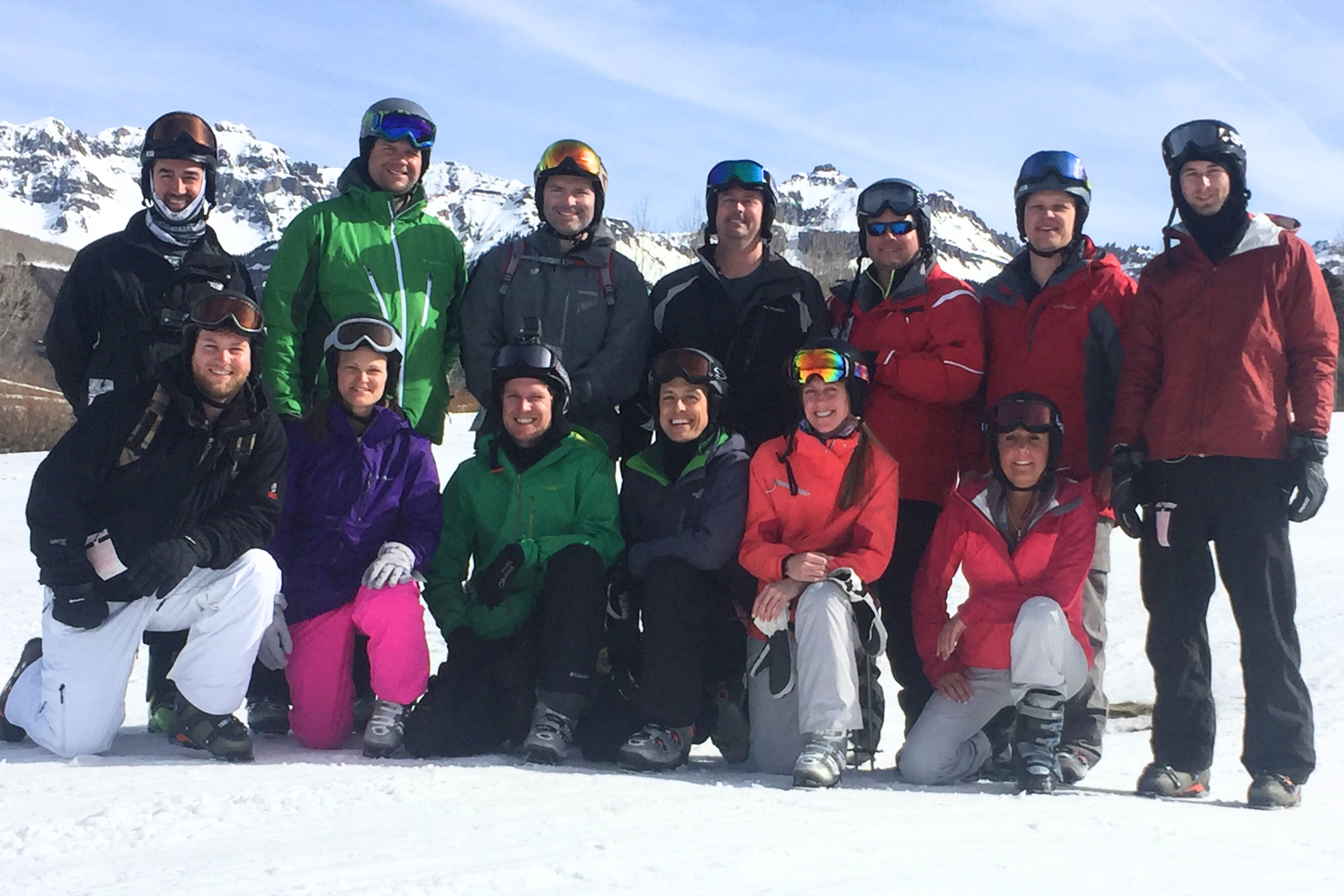 a group of people in ski gear posing for a photo