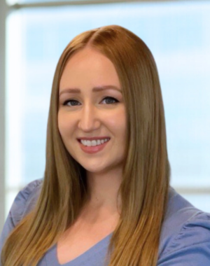 a woman with long hair smiling