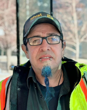 a man with a blue beard and glasses