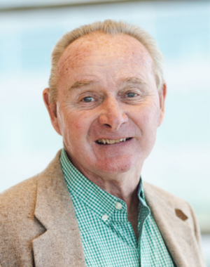 a man in a green and white checkered shirt