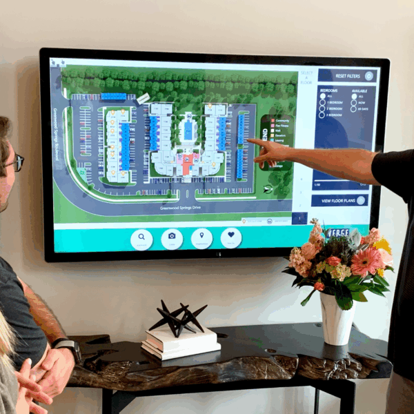 a group of people standing in front of a television